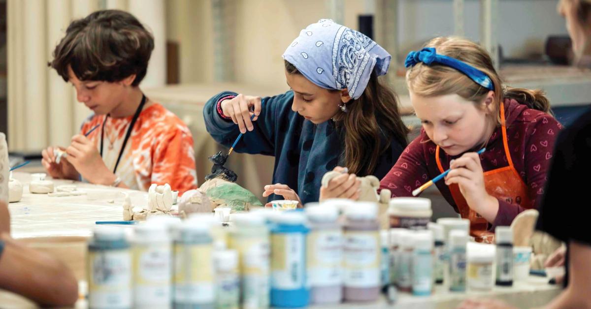 teens painting at table