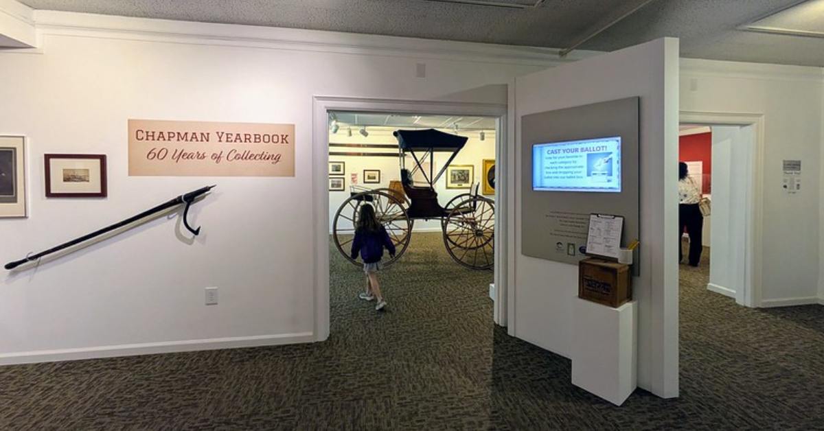 girl walking into a museum room