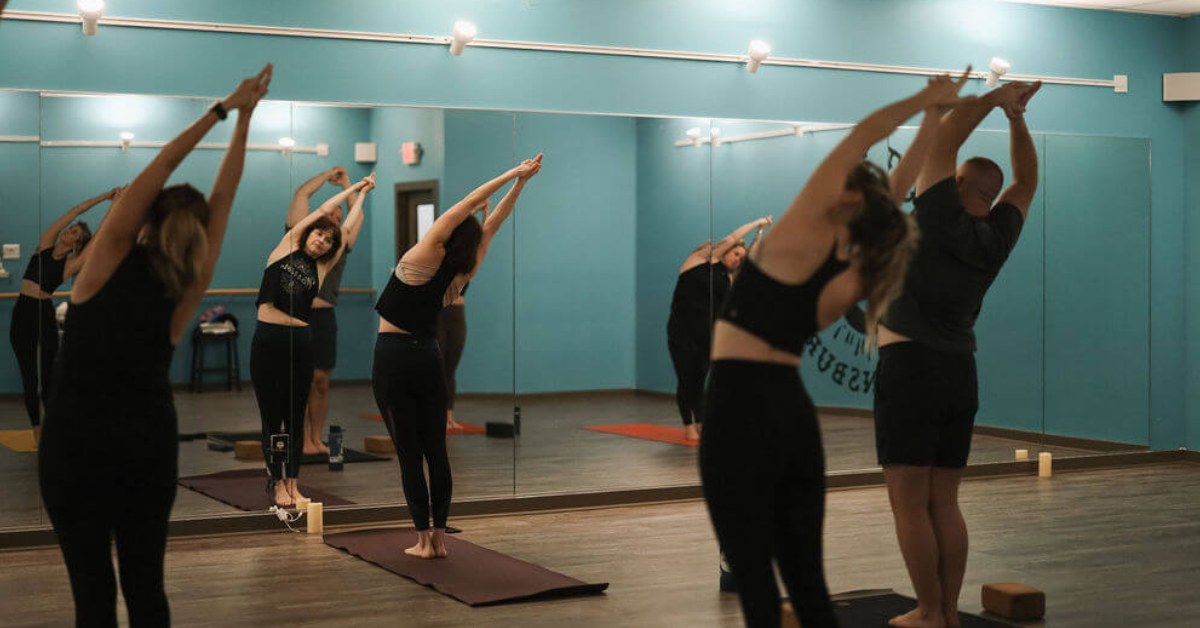 Four people doing yoga