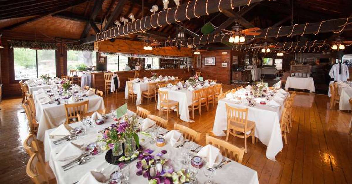 Dining room ready for a reception flowers and wood