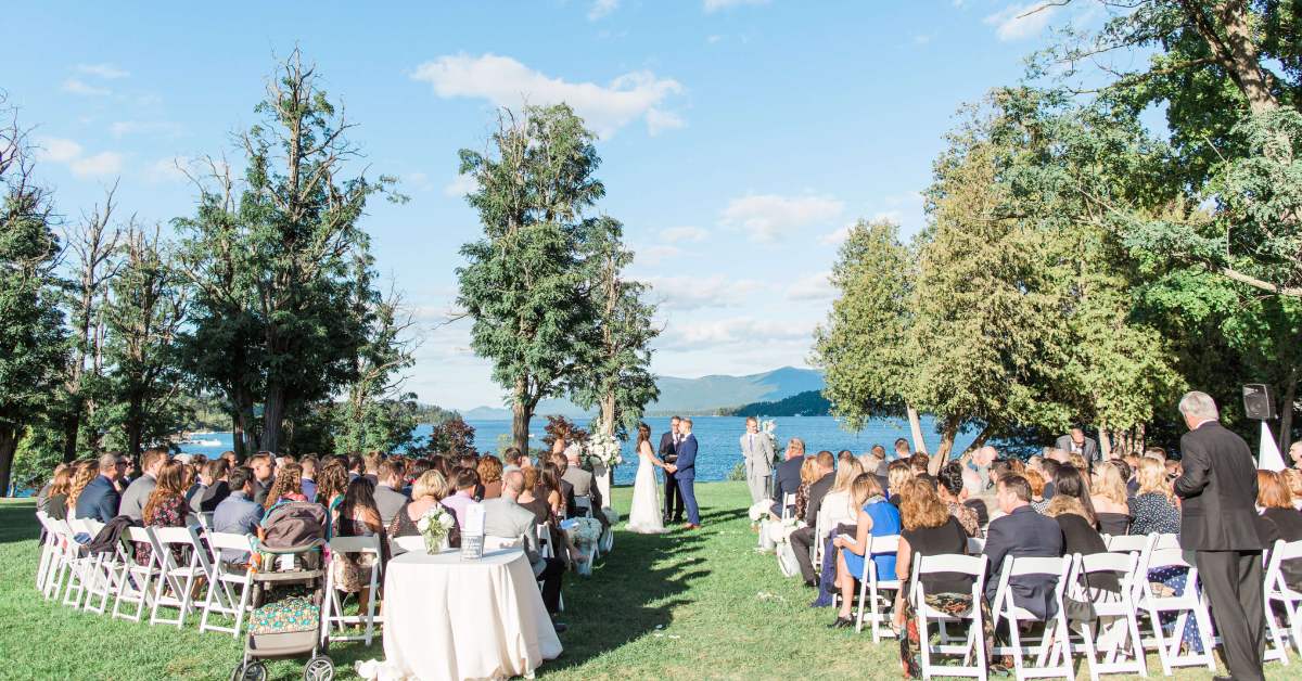 an outdoor ceremony near a lake