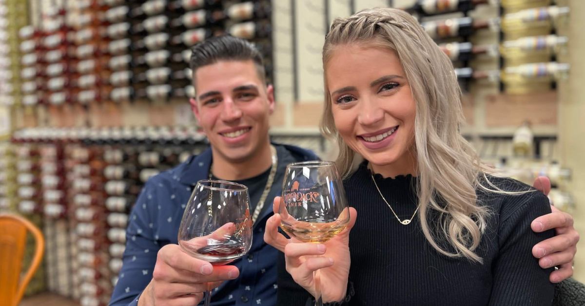 man and woman together in a winery tasting room