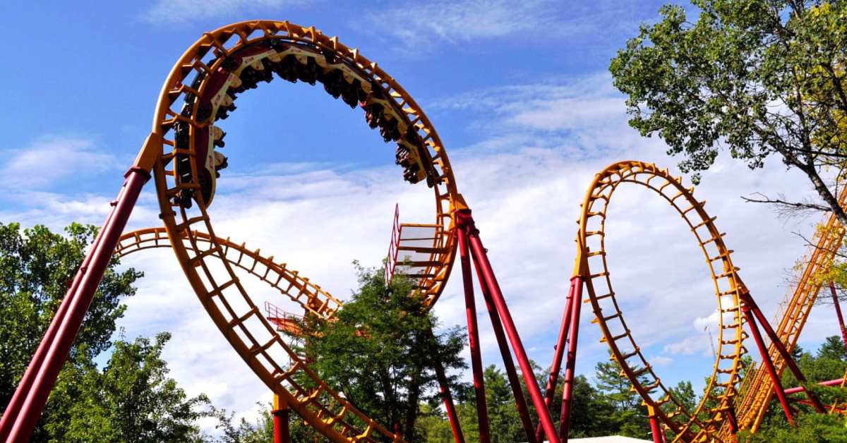 the two loops of the yellow and red flashback rollercoaster with cars hanging upside-down