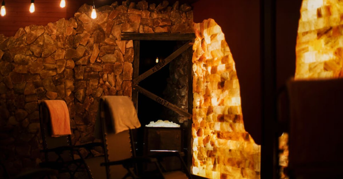 Two chairs in a lit-up stone room