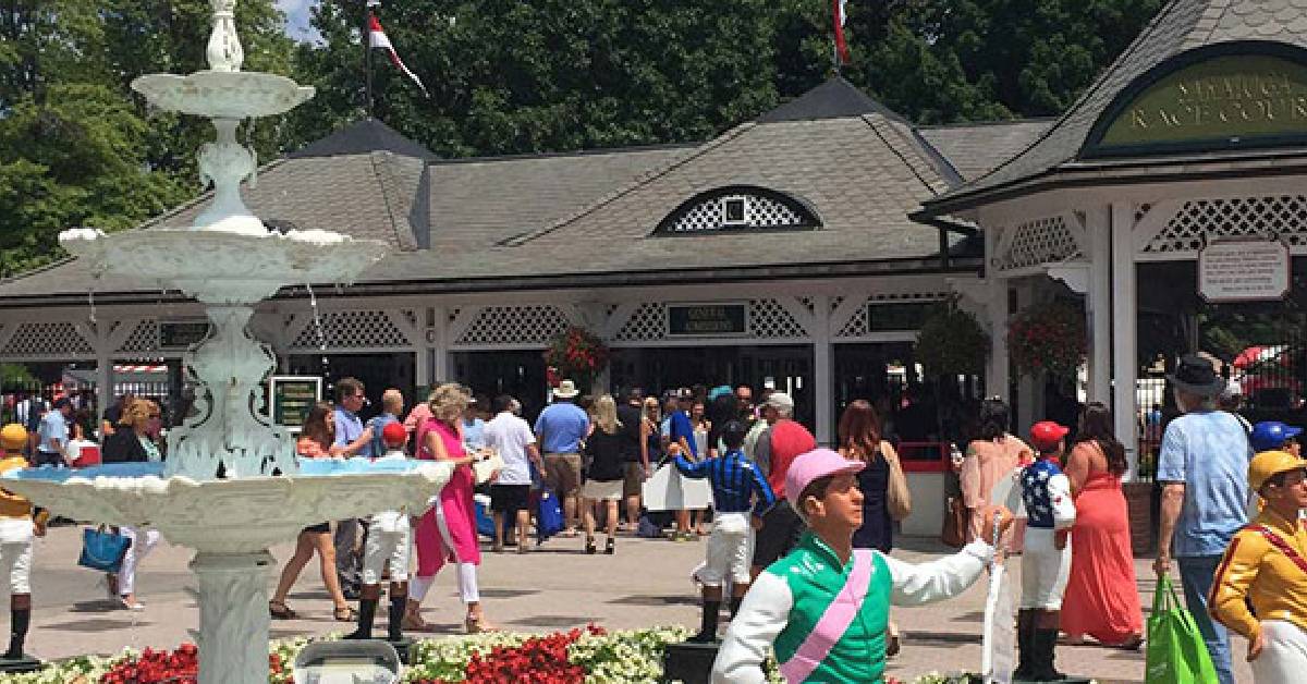 Visitors walking into the main gates of the Track 
