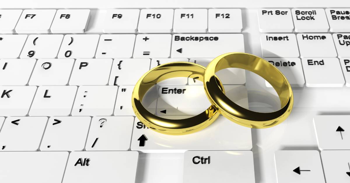 computer keyboard with wedding rings