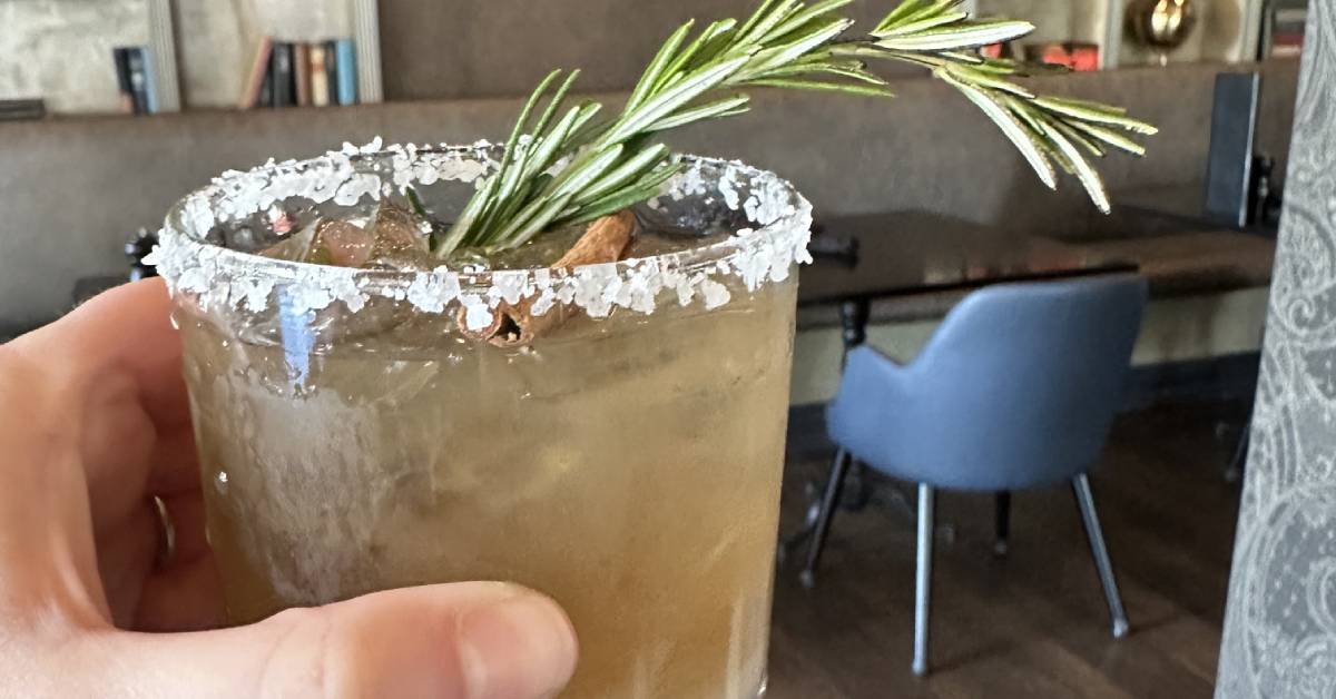 hand holding up cocktail