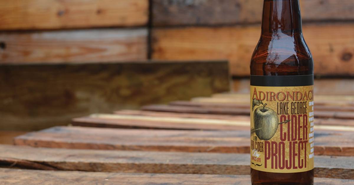 adirondack brewery lake george cider project bottle outside on wooden planks
