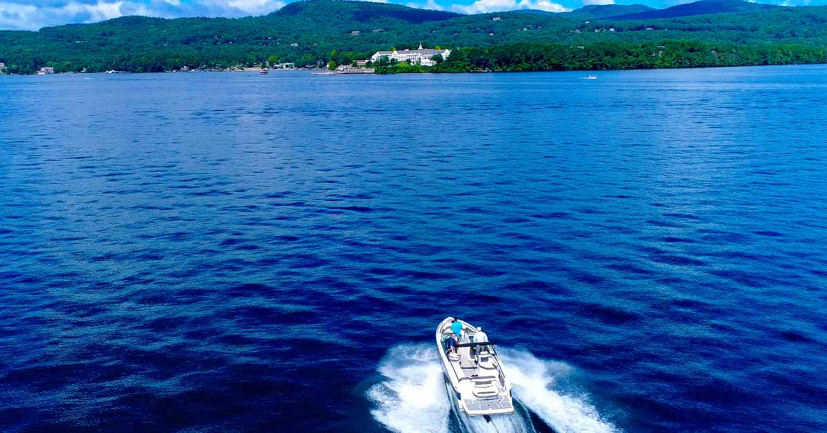 a motorboat on a blue lake