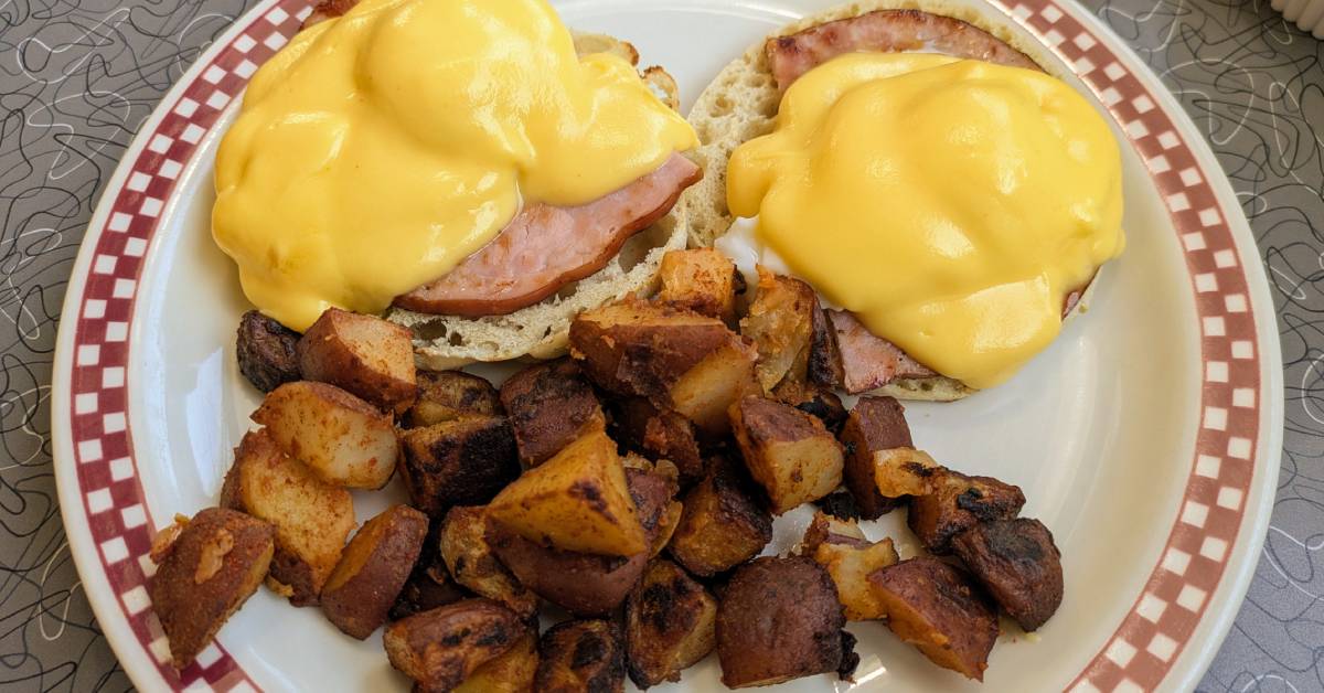 eggs benedict with breakfast potatoes