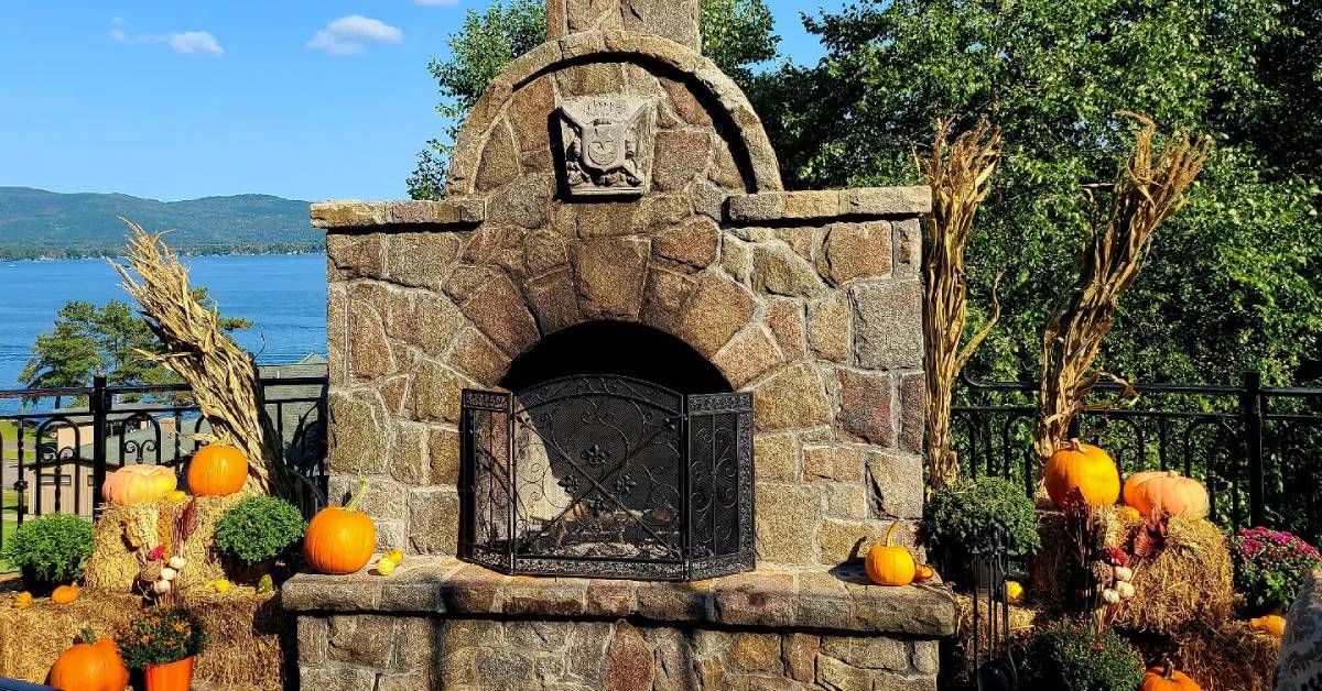 outdoor fireplace decorated for fall at the erlowest