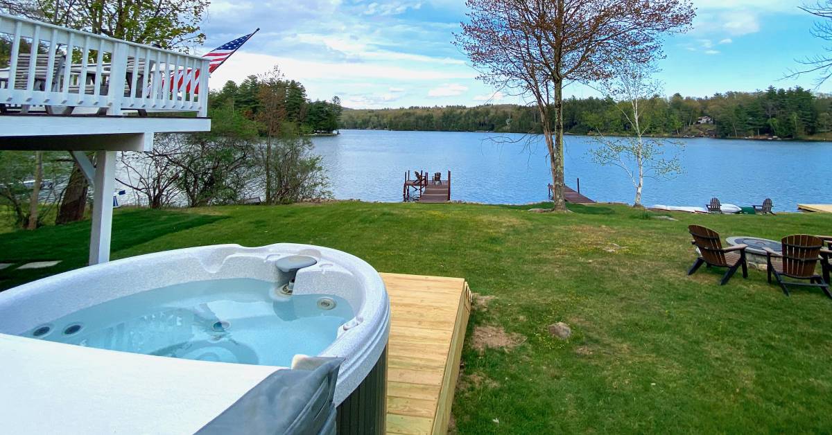 hot tub in backyard by lake