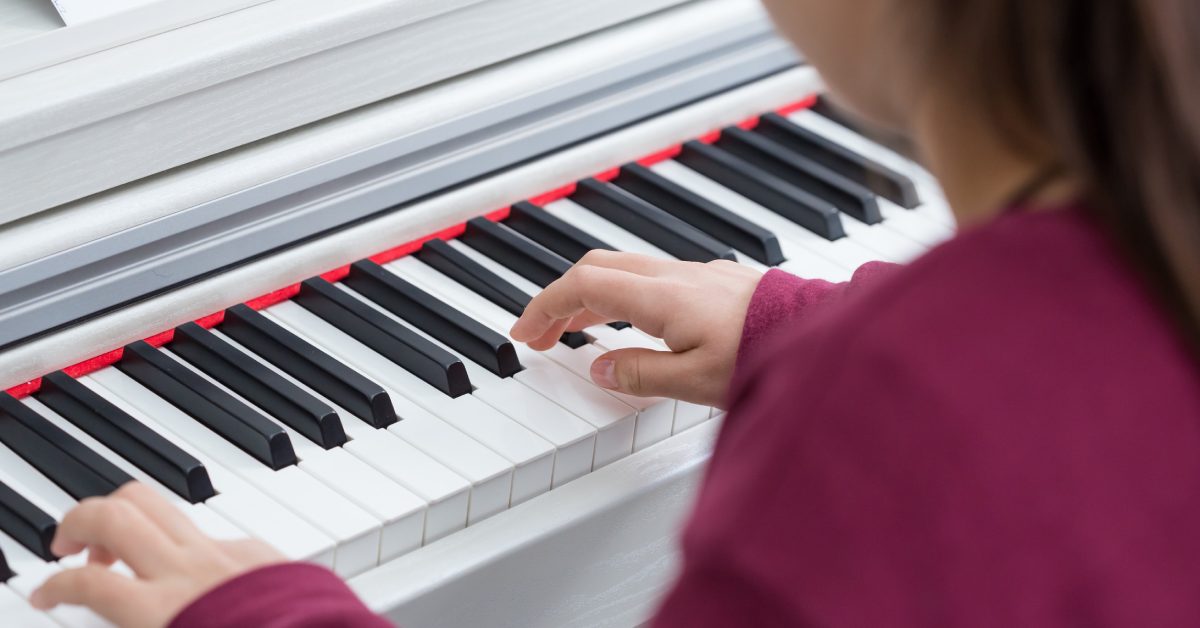 a girl at a piano
