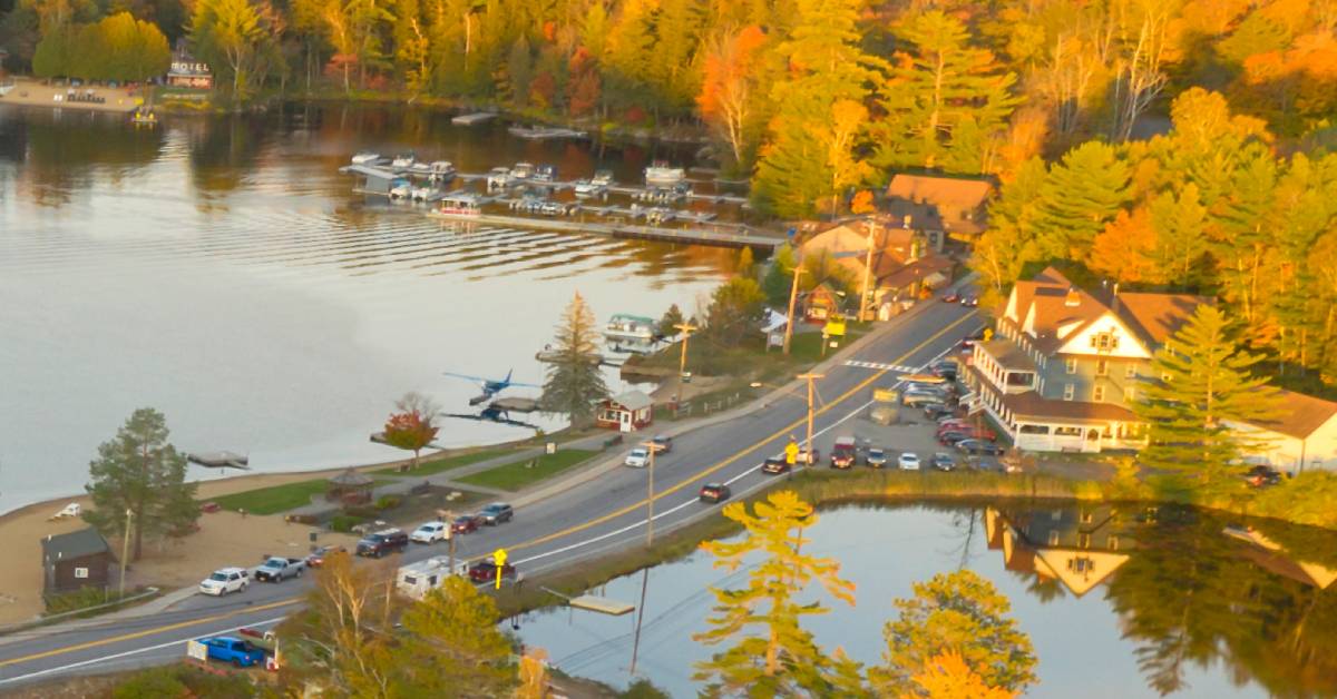 aerial view of adirondack hotel and long lake in fall