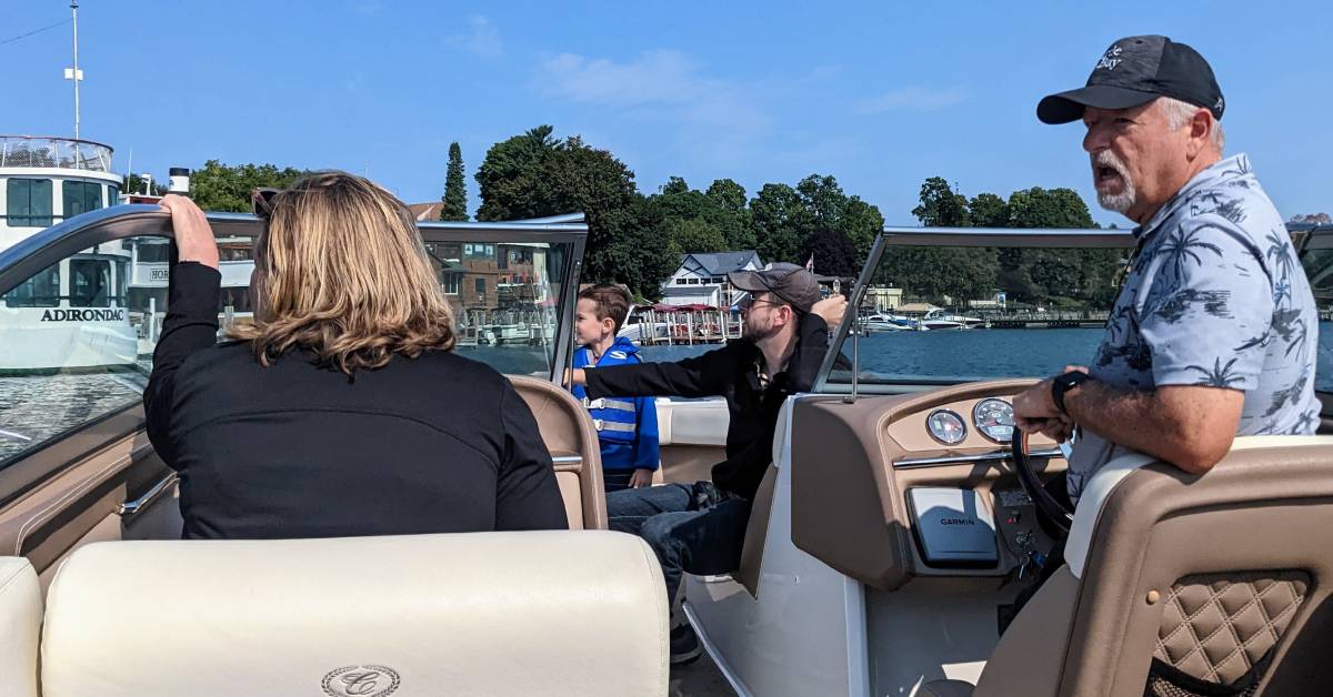 family on boat on lake george