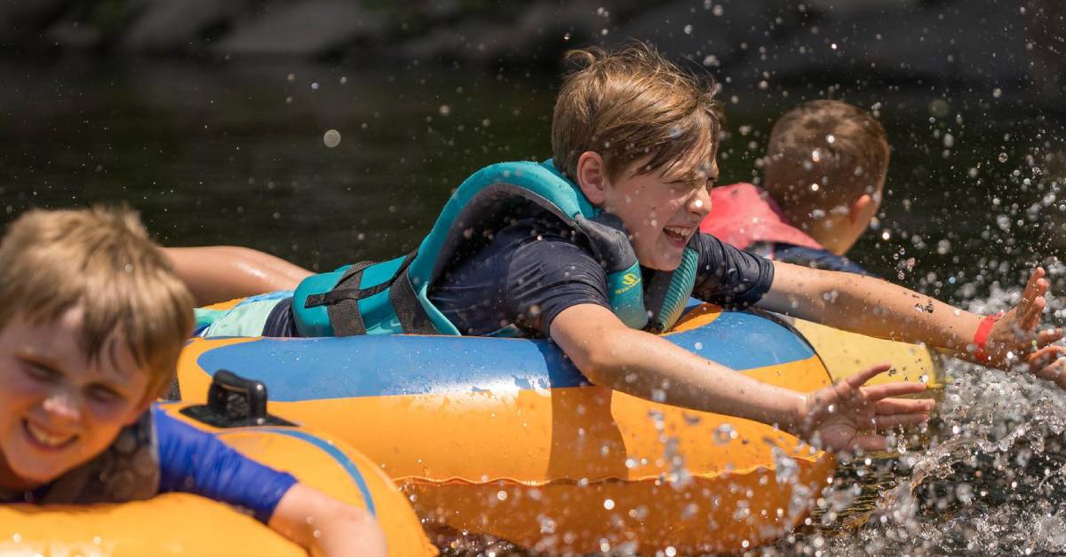 kids having fun in tubes on water