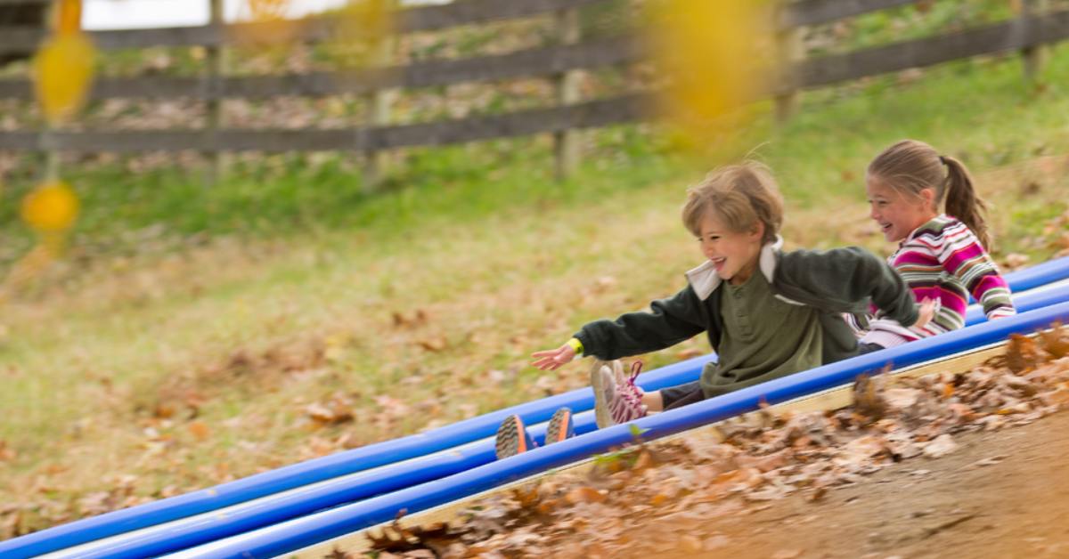 two kids on a slide
