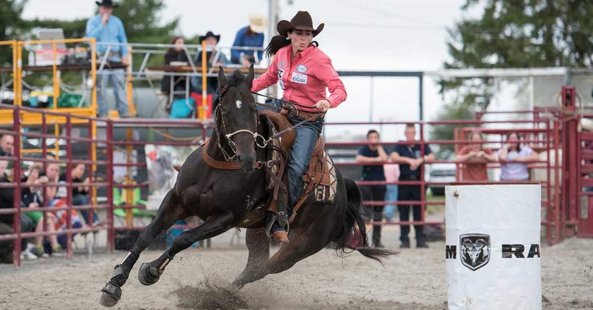 cowgirl on horse in rodeo event
