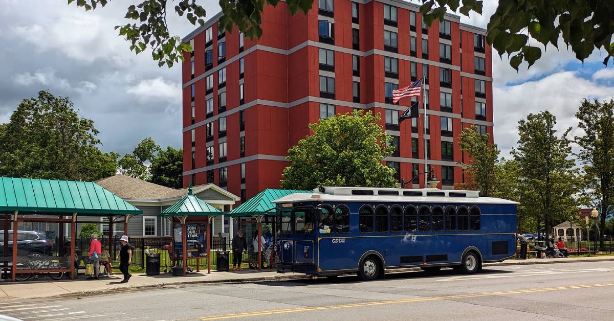 blue trolley at a stop