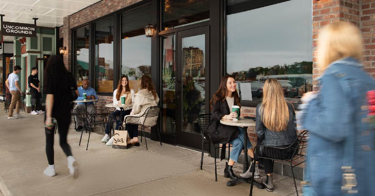 people walking outside of uncommon grounds