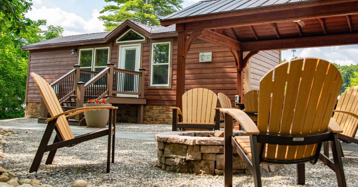 rv/cabin rental with adirondack chairs and fire pit