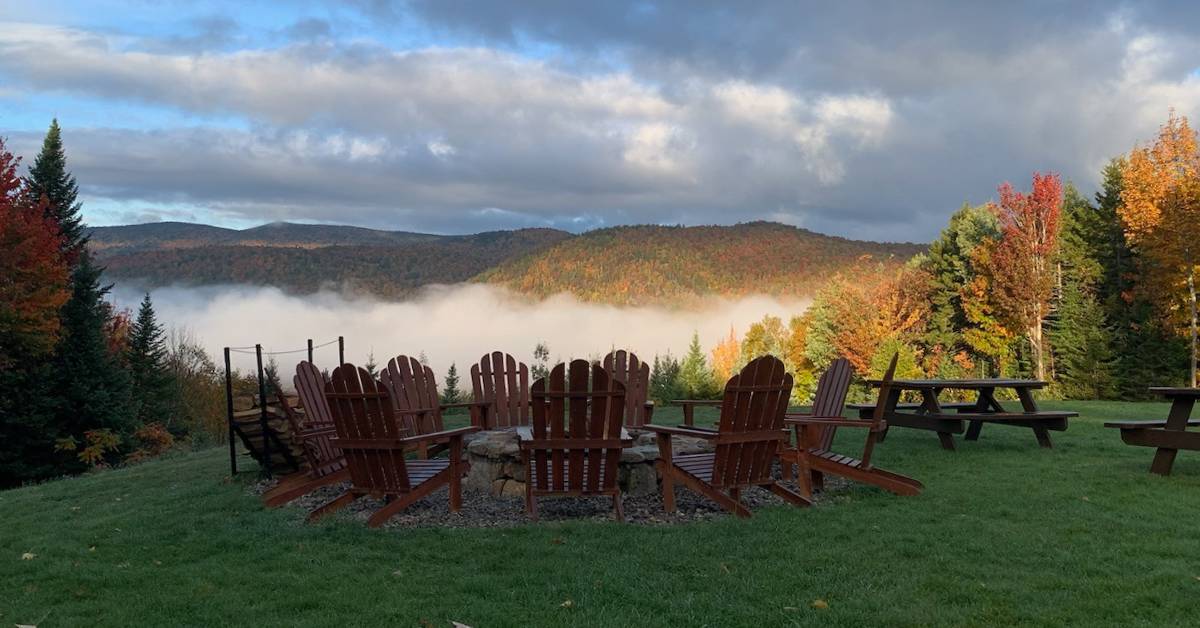 adirondack chairs around fire pit in fall