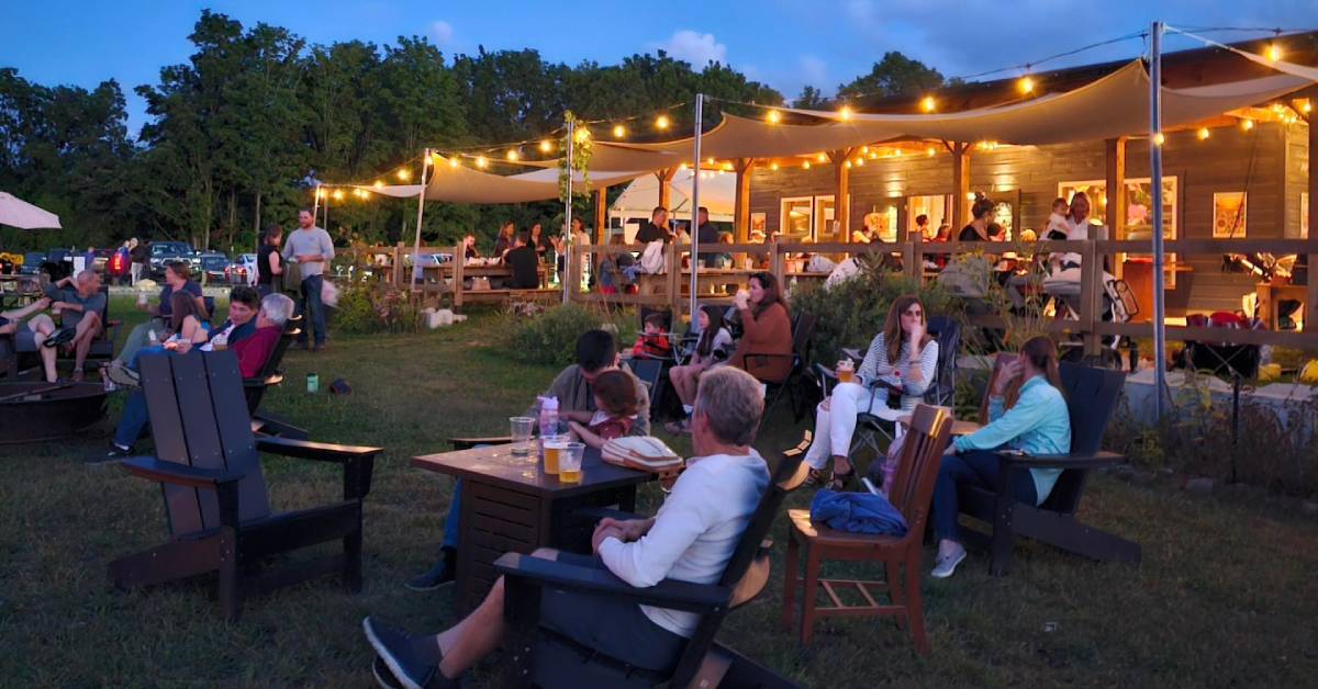 people hanging outside a brewery