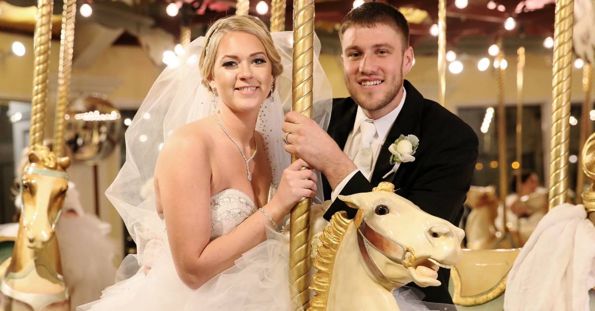 bride and groom on congress park carousel 