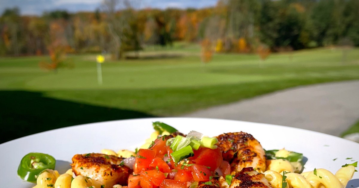 plate of food and golf course in the background