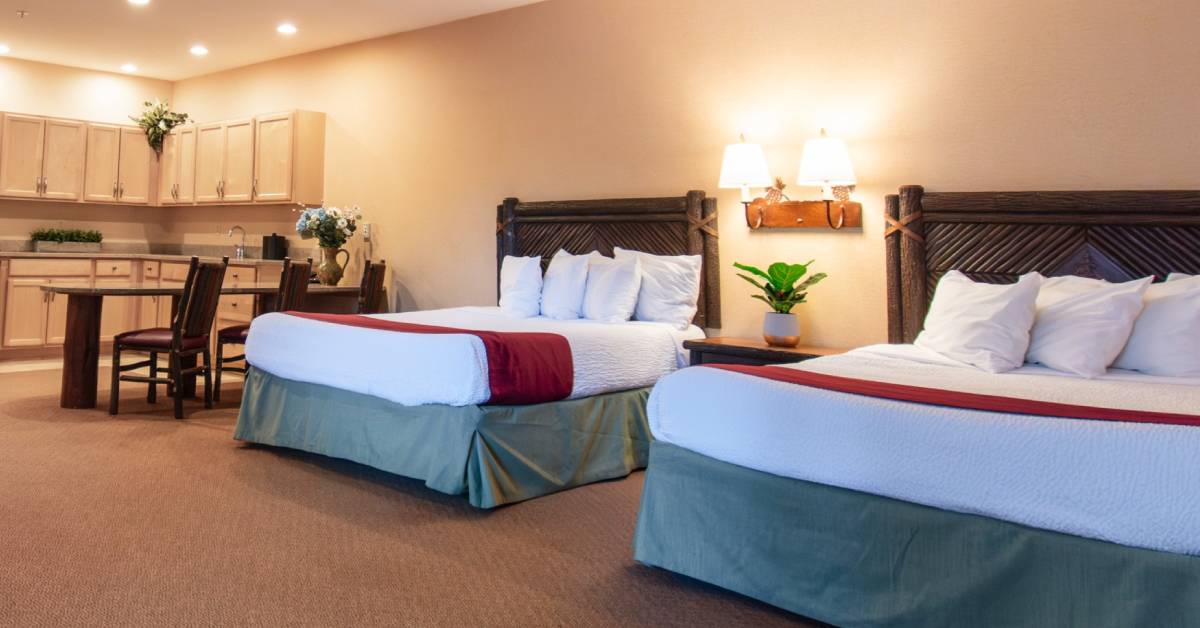 two beds and kitchen area at six flags great escape lodge