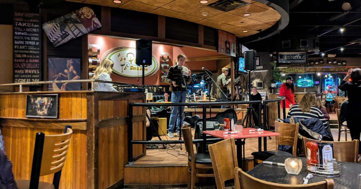 inside of a bar with live music on stage
