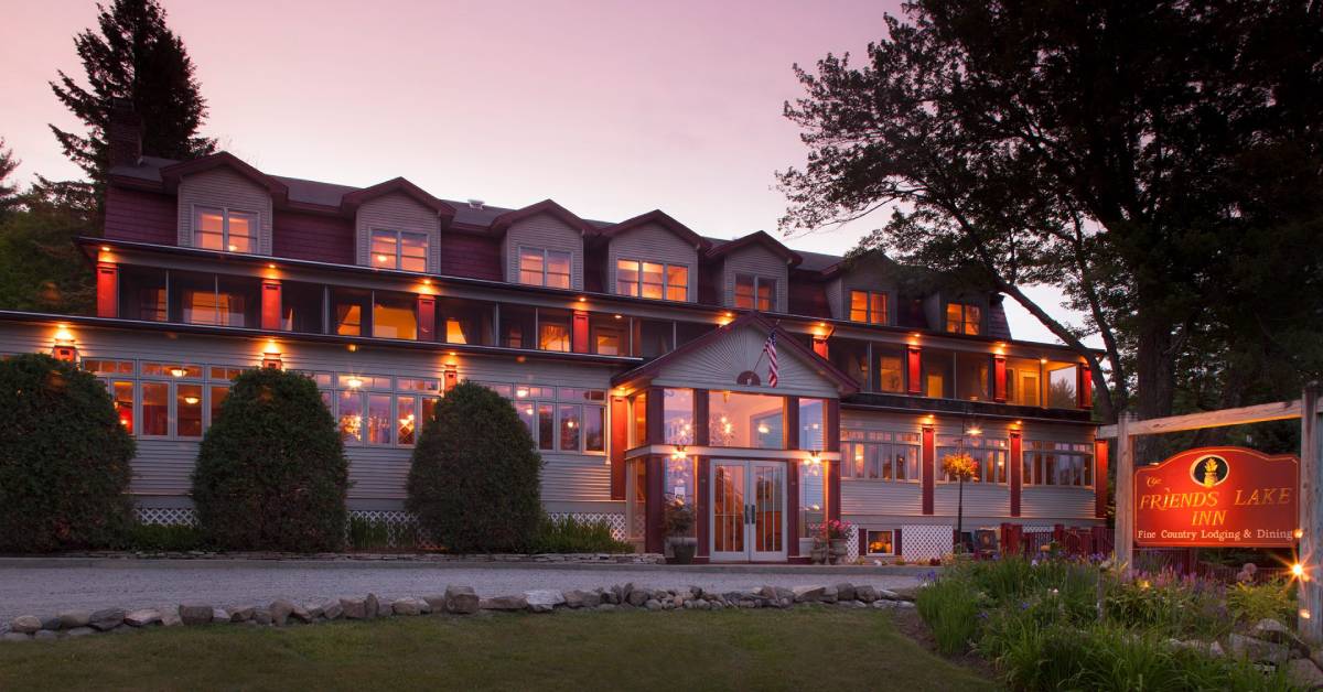 exterior of friends lake inn at dusk