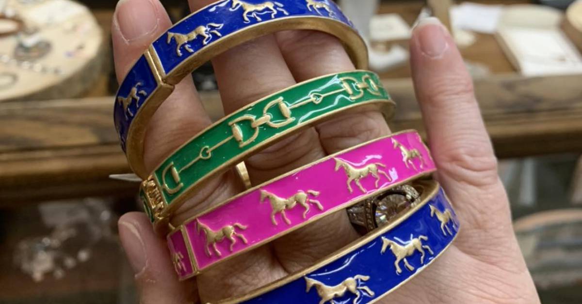hand holding up saratoga horse bracelets