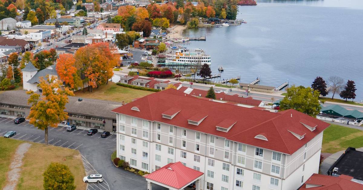 aerial view of fort william henry hotel and lake goerge in fall