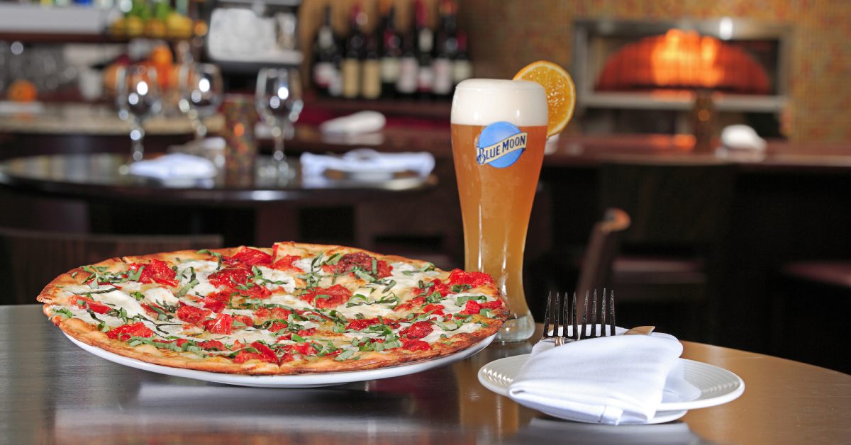 pizza and beer on a table