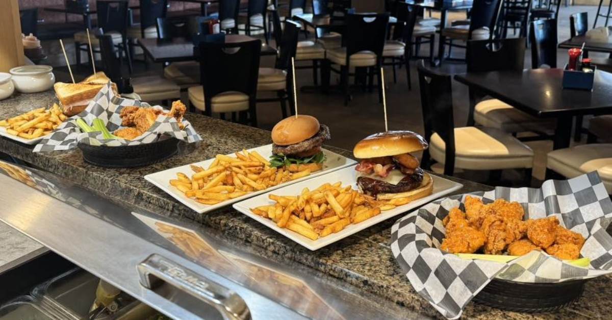 burgers and fries on a counter