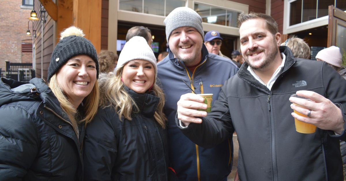 four people at chowderfest with beer
