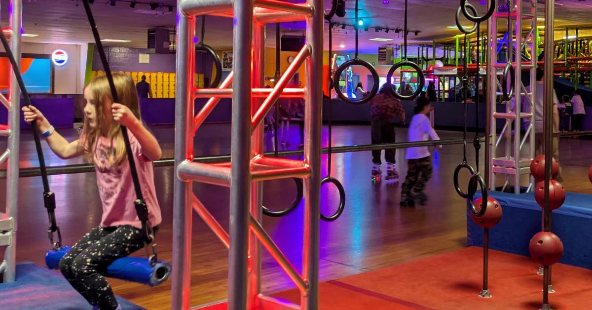 little girl on ninja course at the fun spot