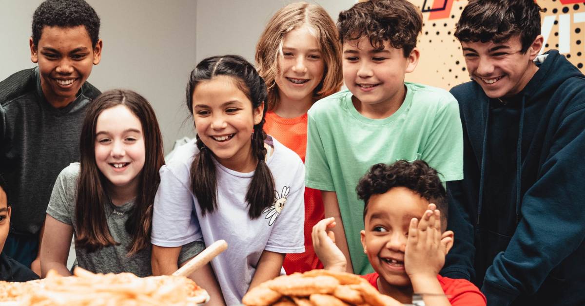kids gather around food