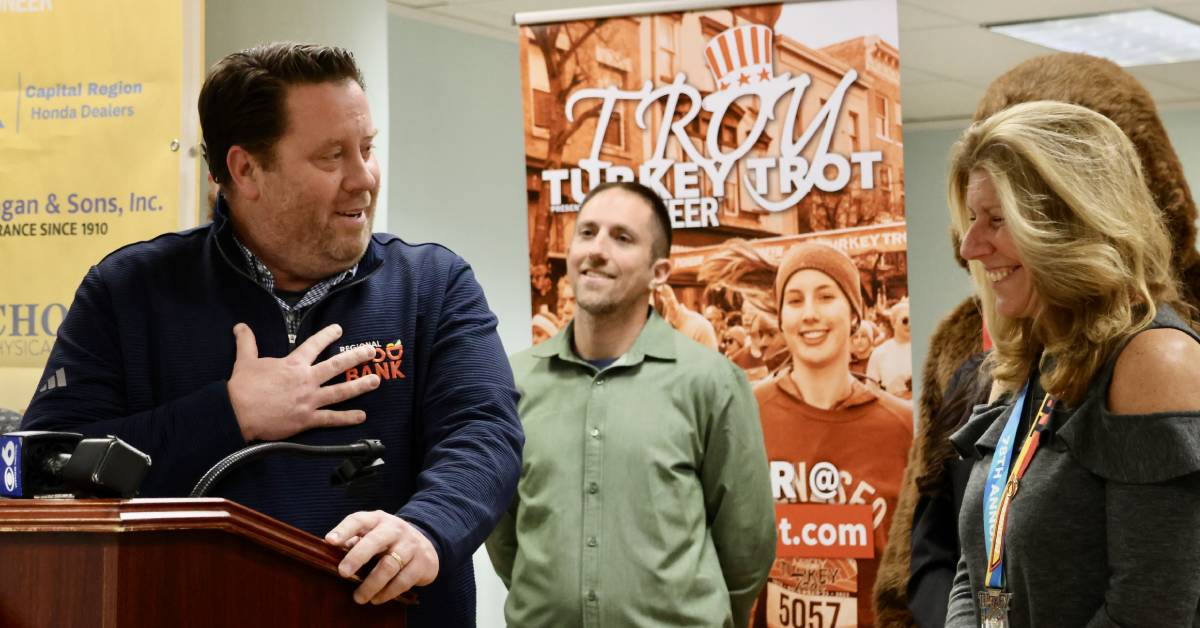 troy turkey trot people at podium