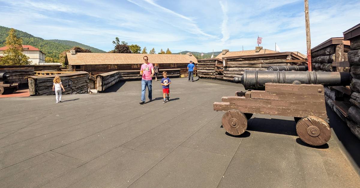 people on rooftop at fort william henry near cannons