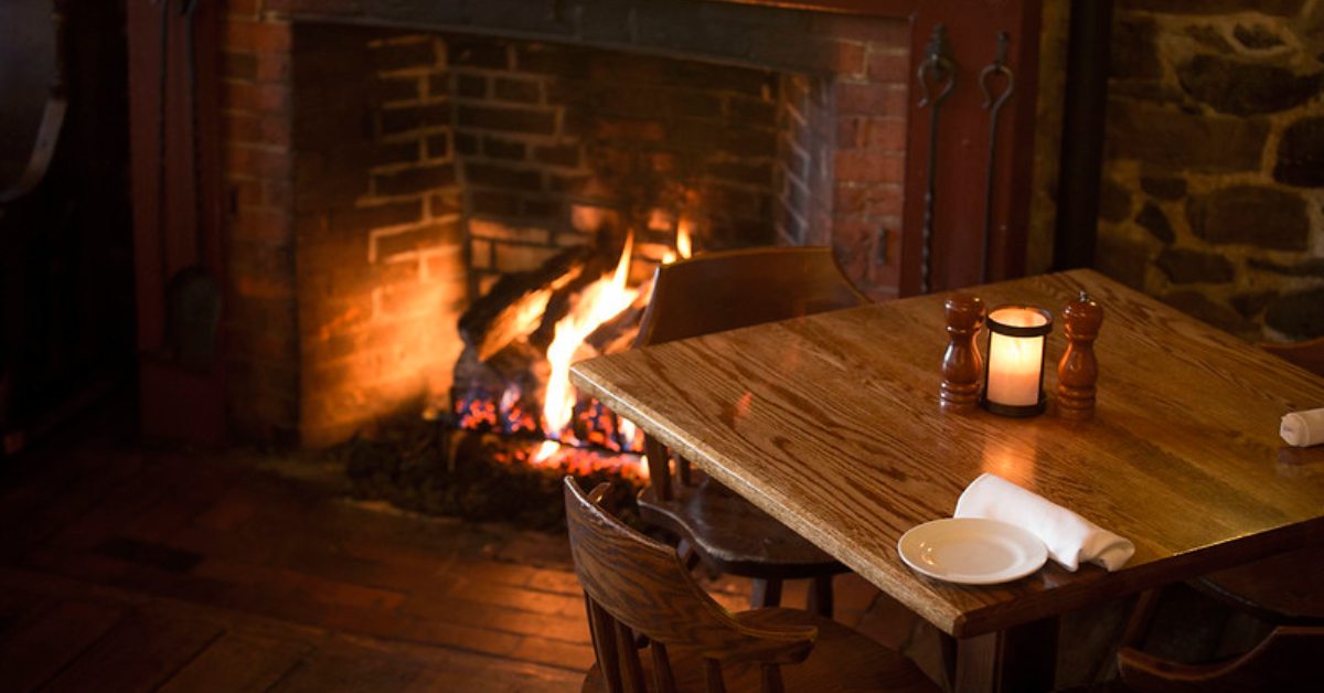 dinner table near a fireplace