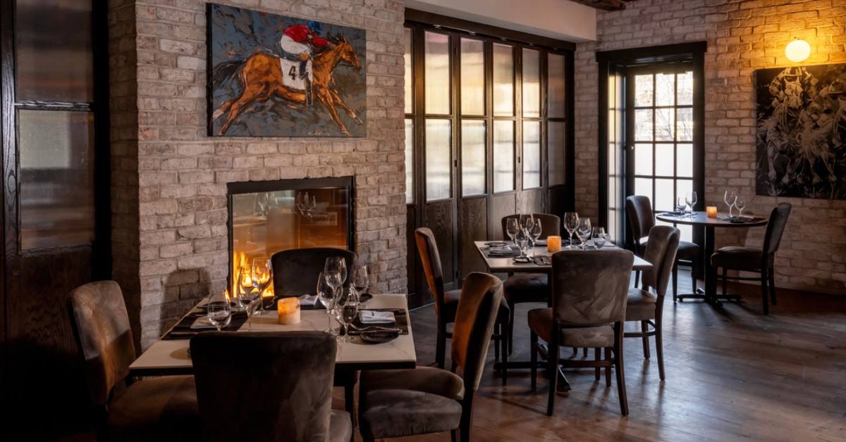 restaurant dinner tables by a fireplace