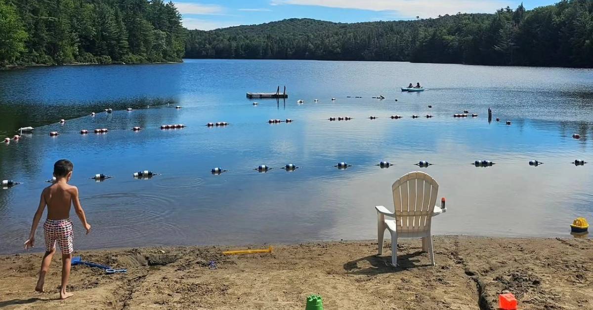 kid on lake beach