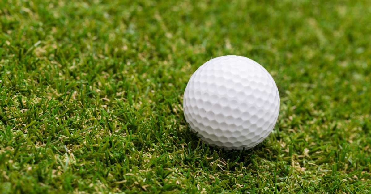 white golf ball on grass