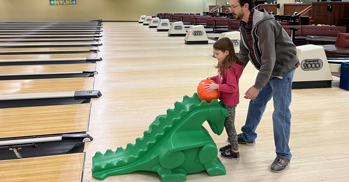 daughter and dad bowling
