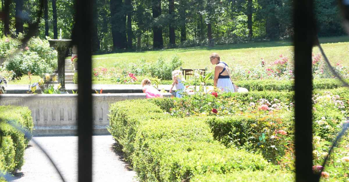 woman and two girls touring Yaddo Gardens