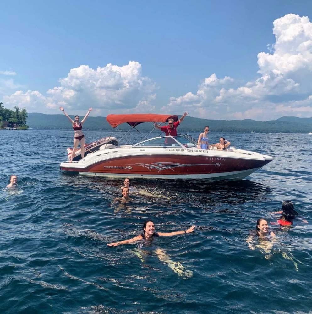 people on and near a boat in the water