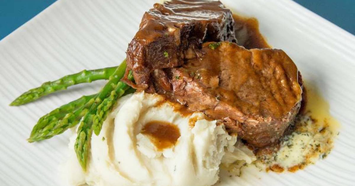 Meat, mashed potatoes, and asparagus’s 