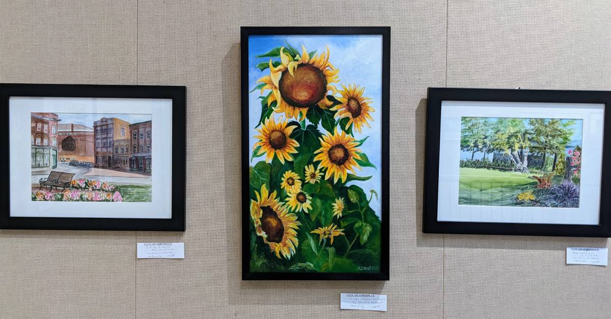 three paintings on wall